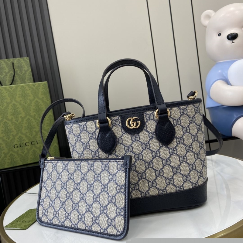 G*u*i shopping bags